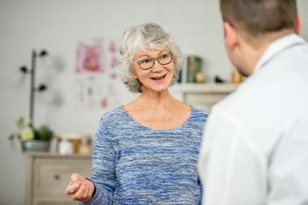 Woman speaking to doctor